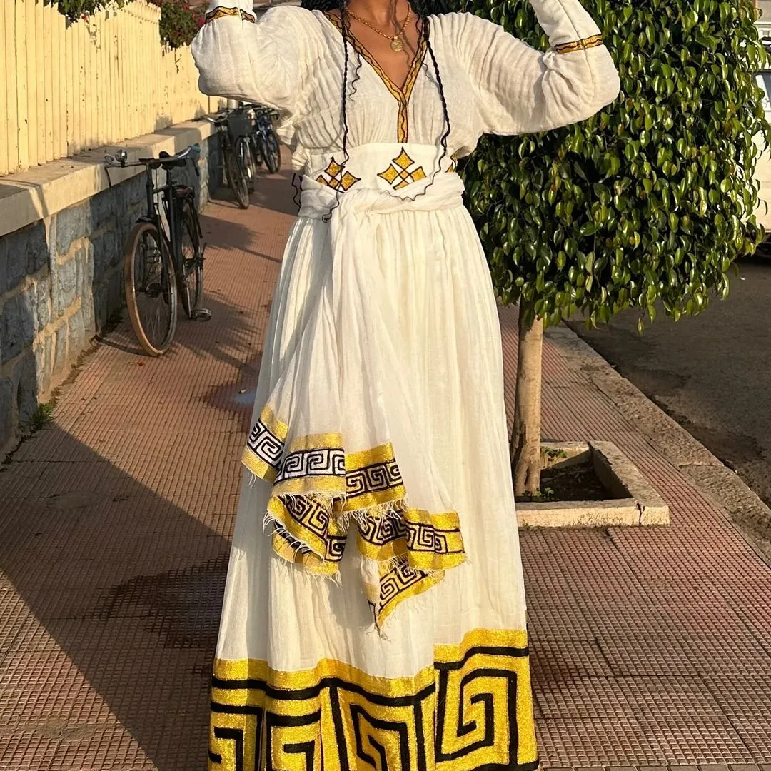 Captivating Yellow and Black Habesha Dress: Perfect for Any Cultural Events Traditional Ethiopian Dress Pretty Habesha Kemis