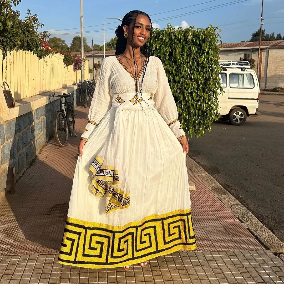 Captivating Yellow and Black Habesha Dress: Perfect for Any Cultural Events Traditional Ethiopian Dress Pretty Habesha Kemis