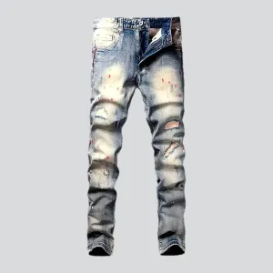 Paint-splattered men's skinny jeans