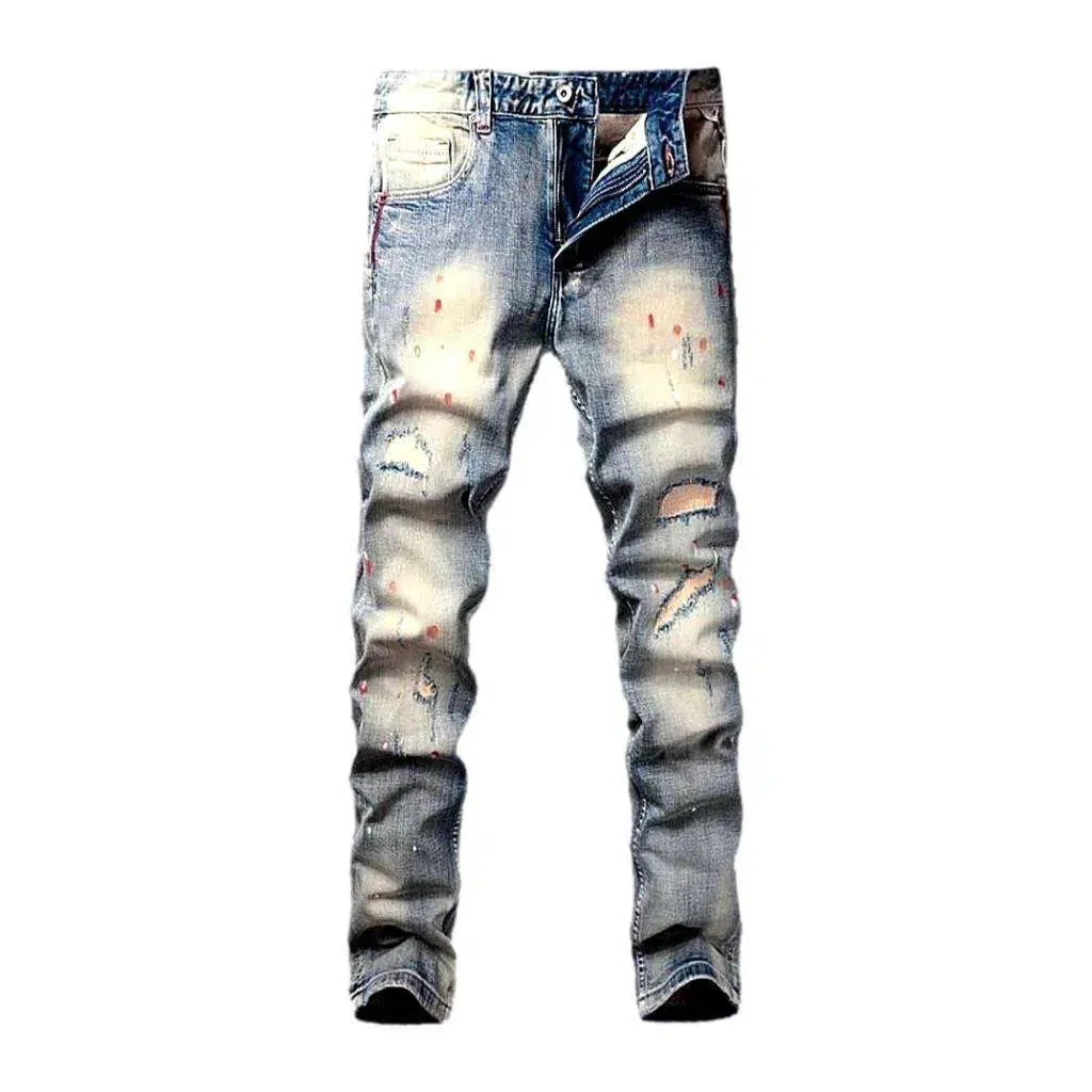 Paint-splattered men's skinny jeans